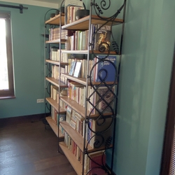 Forged bookshelf in the hallway of a family house forged furniture Forged bookshelf in the hallway of a family house forged furniture
