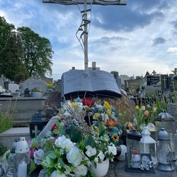 Monument – an open book and a cross on a rock Monument – an open book and a cross on a rock