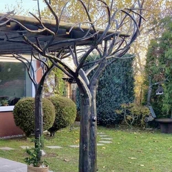 A work of art - a terrace shelter built from hand-forged trees