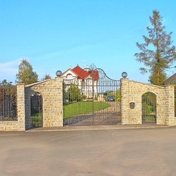 An exclusive wrought iron gate and fence in a family villa - A historic gate and fence